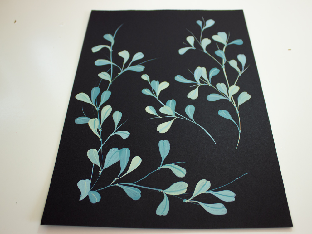 Bright leaves on black paper • Tulla Creative